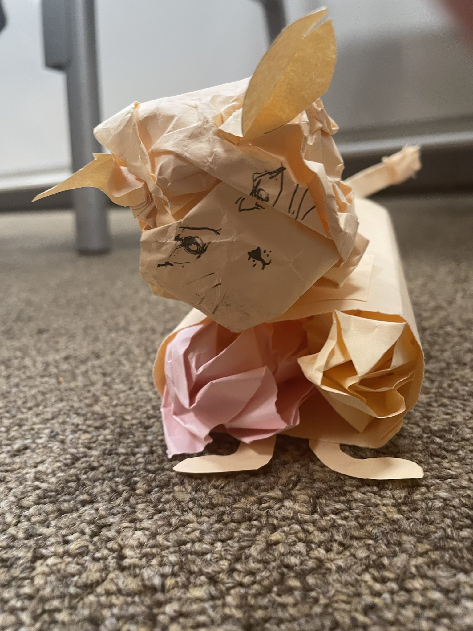 A small lion cub model made of paper.