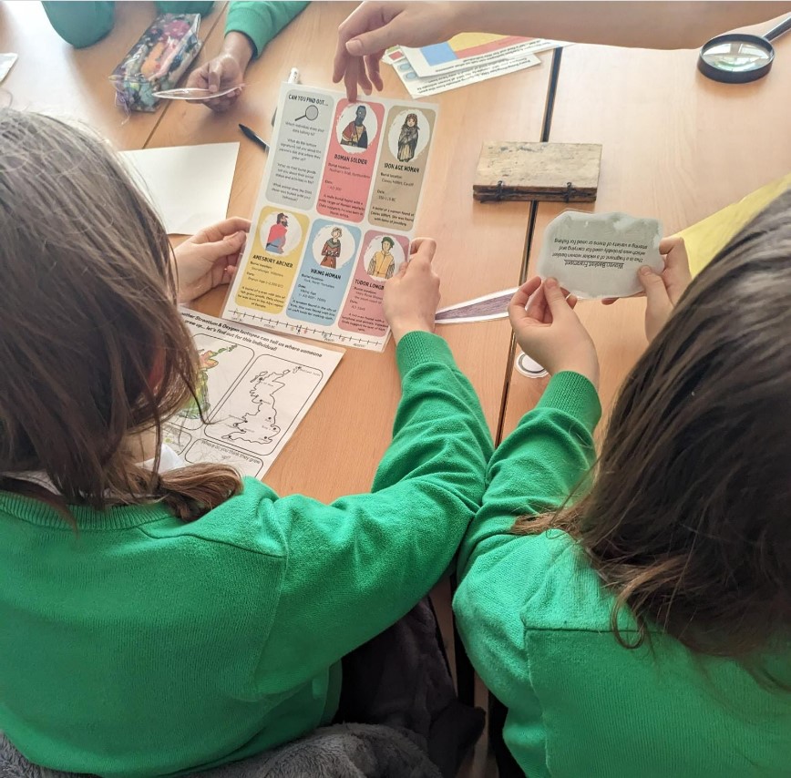 Two Young people looking at a document