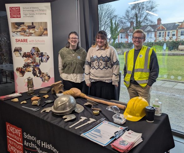 Volunteers Charlotte and Molly alongside Coordinator Cecil at our Grangetown Careers Stall